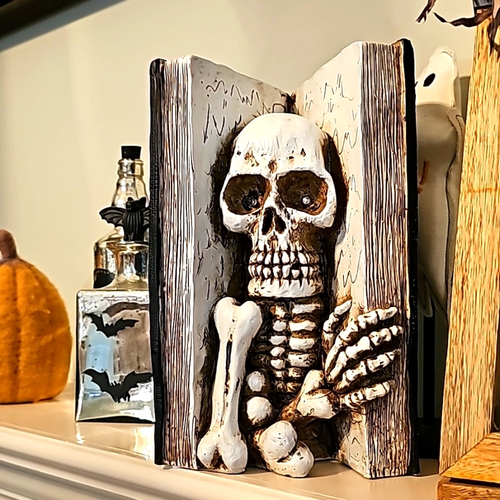 Spells Halloween decor book with skeleton